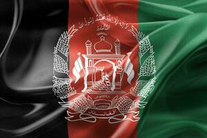 bandeira do afeganistão - bandeira de tecido acenando realista foto