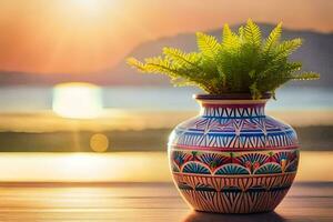 uma colorida vaso com uma plantar em uma mesa dentro frente do a pôr do sol. gerado por IA foto