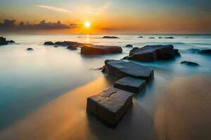 uma grandes exposição fotografia do pedras em a de praia às pôr do sol. gerado por IA foto