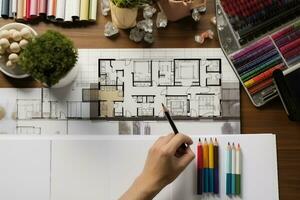 topo Visão do arquitetos mãos desenhando do moderno casa com material amostra em criativo escrivaninha. generativo ai. foto