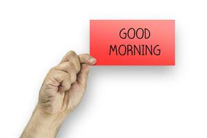 homem segurando vermelho cartão com texto Boa manhã foto