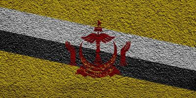 bandeira do brunei darussalam em uma texturizado fundo. conceito colagem. foto