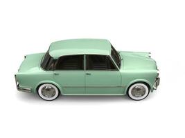 restaurado vintage compactar carro com pastel verde cor pintura - costas lado Visão foto