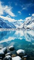 uma deslumbrante lago aninhado no meio coberto de neve montanhas debaixo uma Claro azul céu ai gerado foto