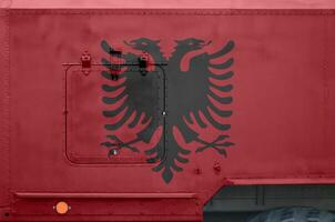 Albânia bandeira retratado em lado parte do militares blindado caminhão fechar-se. exército forças conceptual fundo foto
