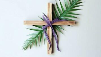 uma cristão de madeira Cruz crucifixo placa com verde Palma folhas Como religioso feriado. Palma domingo evento conceito de ai gerado foto