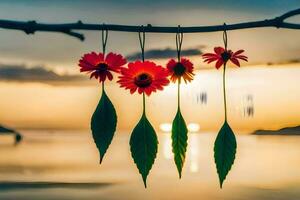 vermelho flores suspensão a partir de uma ramo com a Sol configuração atrás eles. gerado por IA foto