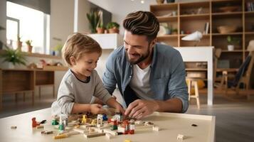 pai e filho estão jogando com tijolos e blocos foto