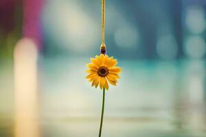 uma amarelo flor suspensão a partir de uma corda. gerado por IA foto
