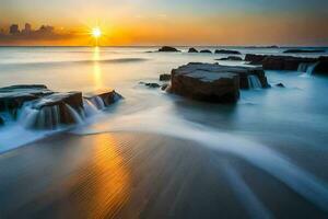 uma lindo pôr do sol sobre a oceano com pedras e água. gerado por IA foto