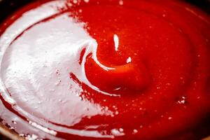 ketchup. macro fundo. a textura do tomate molho. foto