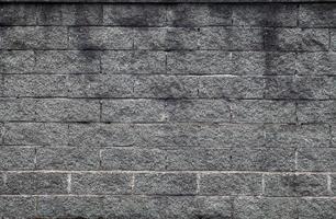 textura do fundo da parede de tijolo de pedra do grunge foto