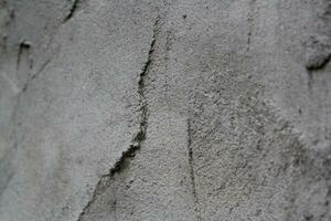 desigual cimento e areia parede textura fundo, sujo cimento parede superfície, rústico areia parede foto