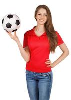 menina bonita com uma bola de futebol foto