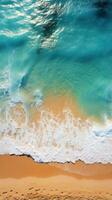 aéreo tiro do uma lotado de praia com nadadores desfrutando a ondas foto