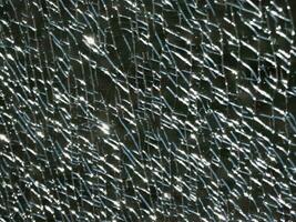textura do rachaduras em uma quebrado vidro mostruário foto