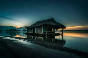 uma pequeno cabana senta em a costa do uma lago às pôr do sol. gerado por IA foto