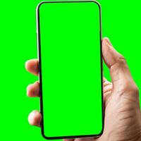 mão mostra Móvel Smartphone com verde tela dentro vertical posição isolado em verde fundo. zombar acima Móvel foto