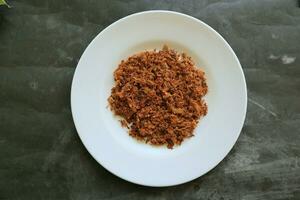 abon fez do carne, picado carne pratos fez com Castanho açúcar e seco, preservado alimentos. indonésio ásia Comida foto