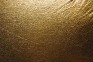 tecido dourado textura amarrotada foto