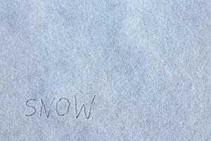 Nevado fundo. inscrição neve em neve. foto