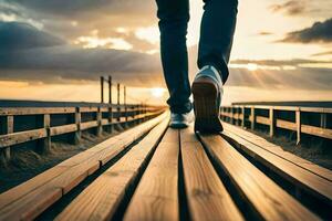 uma pessoa caminhando em uma de madeira ponte às pôr do sol. gerado por IA foto