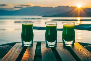 três óculos do verde suco sentar em uma mesa dentro frente do a pôr do sol. gerado por IA foto
