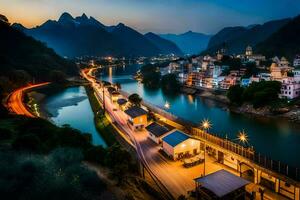 uma rio e Cidade às crepúsculo dentro a montanhas. gerado por IA foto