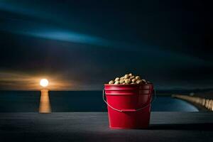 uma vermelho balde preenchidas com amendoim em uma mesa dentro frente do a oceano. gerado por IA foto