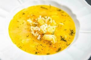 sopa vegetal arroz caldo, batata, cenoura, cebola saudável comendo cozinhando refeição Comida lanche em a mesa cópia de espaço Comida fundo rústico topo Visão foto