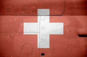 Suíça bandeira retratado em lado parte do militares blindado helicóptero fechar-se. exército forças aeronave conceptual fundo foto