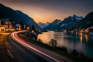 uma carro drives baixa uma estrada dentro frente do uma lago às pôr do sol. gerado por IA foto