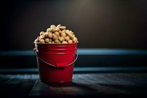 uma vermelho balde preenchidas com amendoim sentado em uma mesa. gerado por IA foto