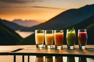 cinco óculos do suco em uma mesa dentro frente do uma montanha. gerado por IA foto