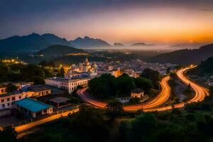 uma cidade às crepúsculo com uma enrolamento estrada e montanhas dentro a fundo. gerado por IA foto