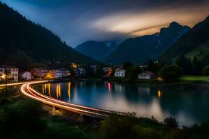 uma rio e montanha alcance às noite com luzes em a ponte. gerado por IA foto