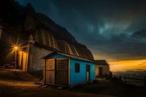 uma azul cabana senta dentro a meio do uma montanha às pôr do sol. gerado por IA foto