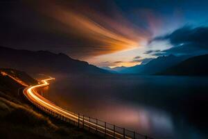 uma grandes exposição fotografia do uma estrada e lago às noite. gerado por IA foto