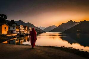 uma homem dentro vermelho vestes anda em ao longo a costa do uma lago às pôr do sol. gerado por IA foto