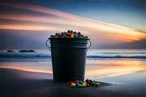uma balde do colorida doces em a de praia às pôr do sol. gerado por IA foto