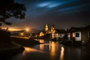 uma rio às noite com casas e uma igreja. gerado por IA foto