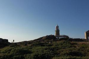 farol corrubedo no oceano atlântico, galiza, espanha foto