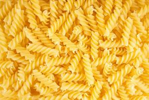 cru massa fusilli espaguete padronizar. Comida fundo, italiano cozinha foto