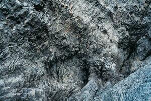 abstrato islandês áspero basalto Rocha natural parede padronizar foto
