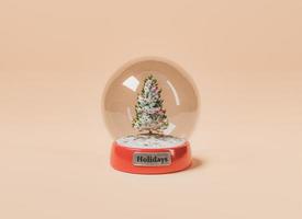 esfera de cristal com árvore de natal foto