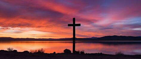 conceito ou conceptual madeira Cruz ou religião símbolo forma sobre uma pôr do sol céu fundo bandeira ai gerado foto