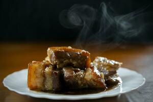 refogado carne de porco barriga dentro doce Preto soja molho, chinês Comida. foto