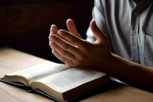 mãos juntos dentro Rezar para Deus ao longo com a piedosos Bíblia livro. ai generativo foto