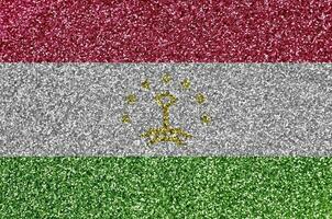 tajiquistão bandeira retratado em muitos pequeno brilhante lantejoulas. colorida festival fundo para festa foto