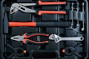 Caixa de ferramentas com mão instrumentos para reparar e manutenção, fechar acima foto